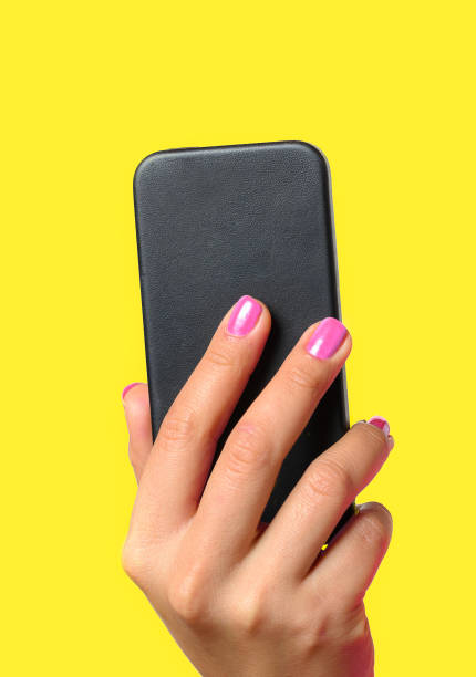 istock Young woman holding a mobile phone 909561920