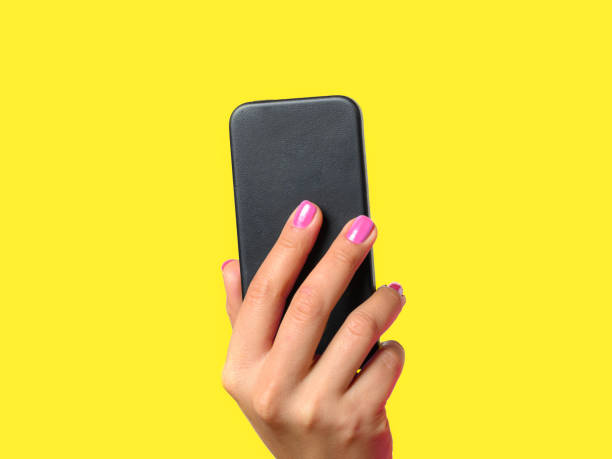 istock Young woman holding a mobile phone 909562000