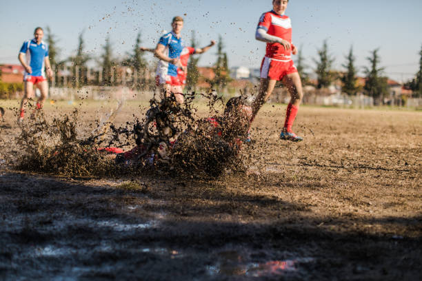 istock Falling in mud on rugby field 909562314