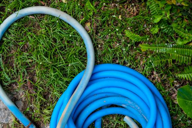 istock Rubber tube in the garden 909562556