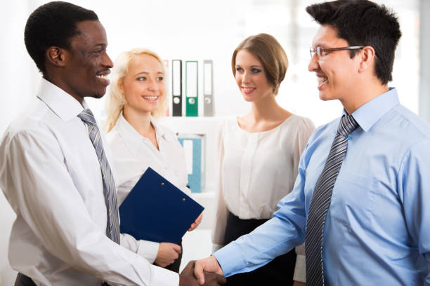 istock Business people shaking hands 909562782