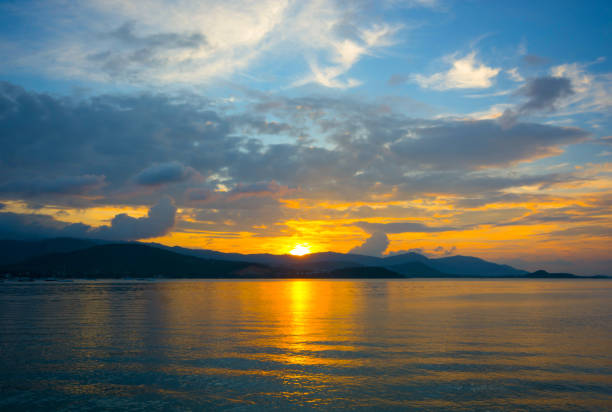 istock BEAUTIFUL TWILIGHT SKY CLOUD AND SUNSET ABOVE ISLAND 909565238