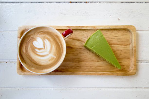 coffee and cake in wood plate on table