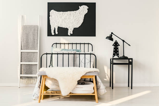 istock Sheep poster in bedroom interior 909565598
