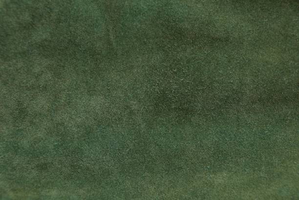 istock green fabric texture from a piece of cloth clothes 909568572