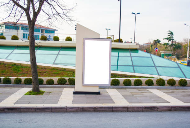 istock blank vertical street billboard stand with city background 909569056