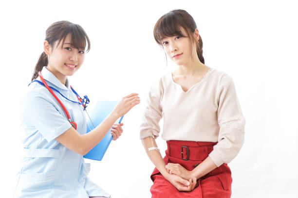 istock Nurse putting woman on a drip 909569452