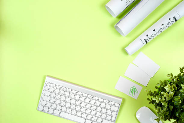 istock Workplace of architect - rolls and plans. 909570016