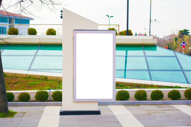 istock blank vertical street billboard stand with city background 909570108