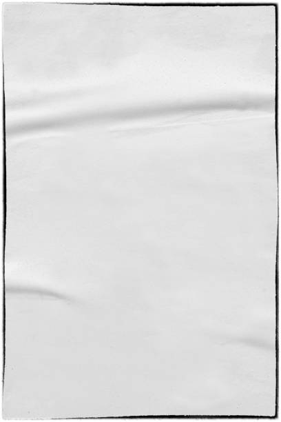 istock Vintage ripped torn creased crumpled paper background surface/ Old posters grunge textures collage background 909572864