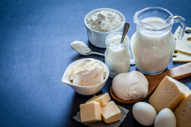 istock Dairy products shot on bluish tint background 909573712