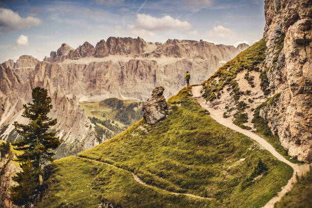istock Dolomites scenics view: man hiking 909574034