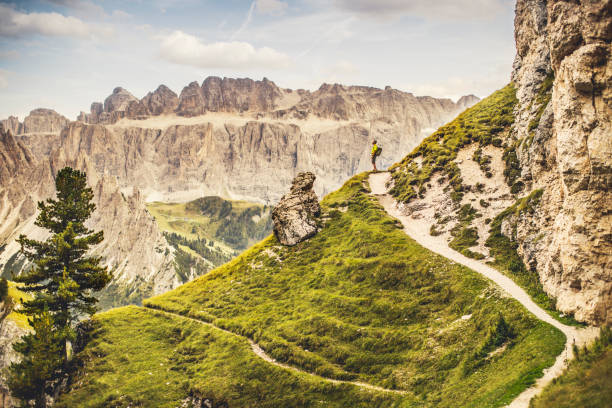 istock Dolomites scenics view: man hiking 909574068