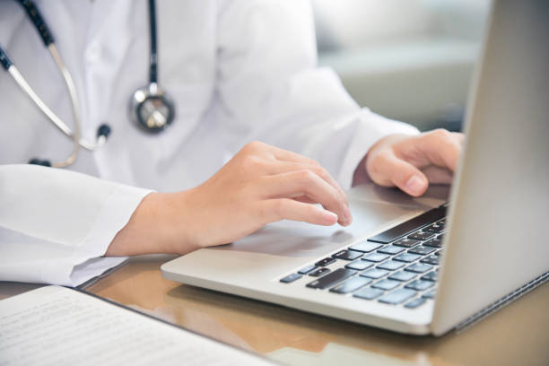 istock Female Doctor working with laptop. 909574076