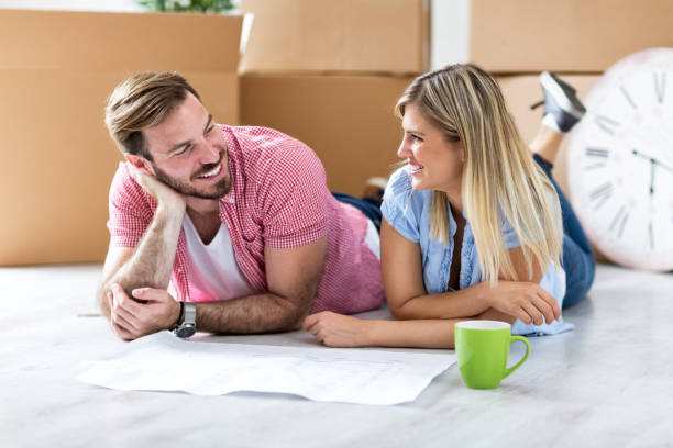 istock Young couple making plan about there new home 909574420
