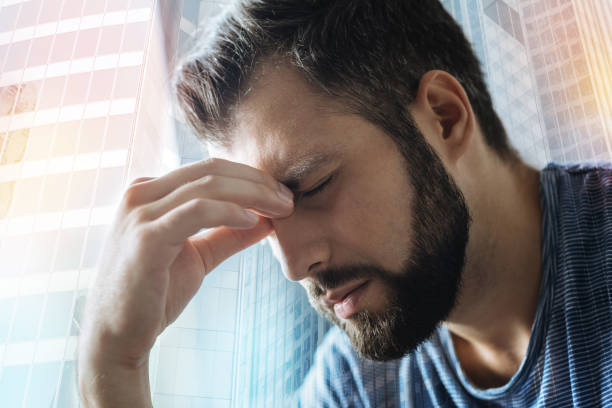 istock Sick disappointed man feeling bad himself and closing eyes 909574630