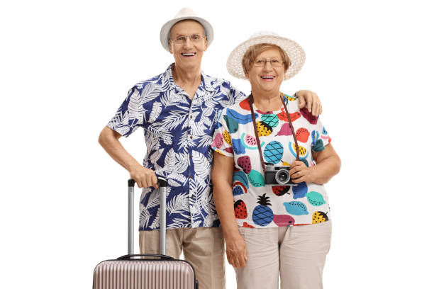 istock Old tourists with a suitcase 909575266