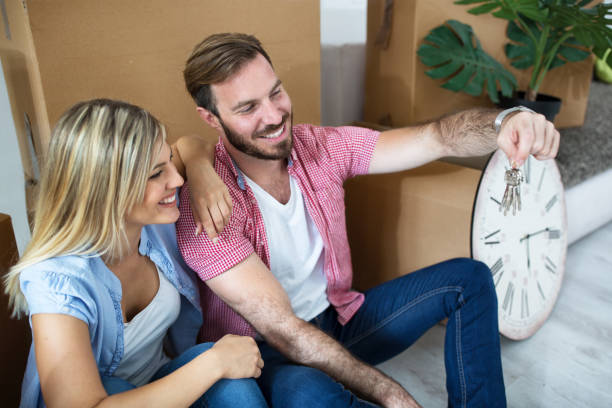 istock Young couple celebrating moving to new home 909581996