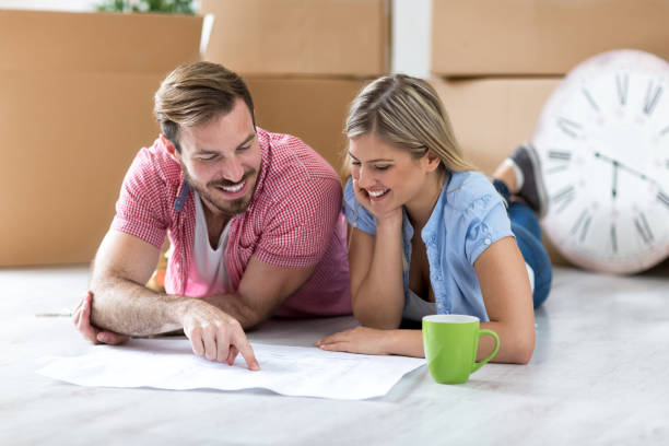 istock Young couple making a plan about there new home 909582436