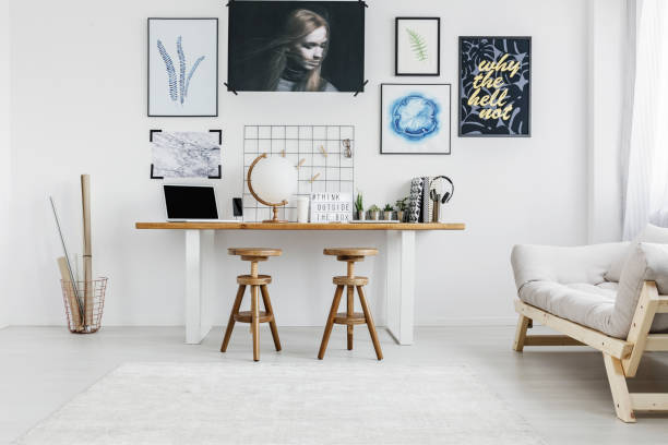 istock Wooden stools in living room 909582748