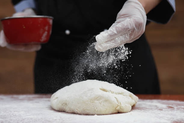 istock the cook makes flour for baking on the table 909586282