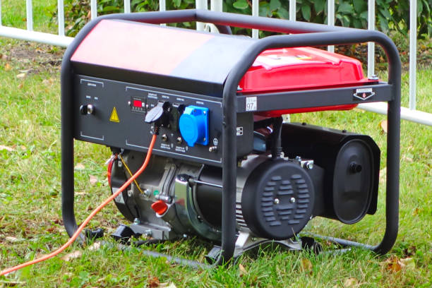 Portable power generator Working portable electric generator on green grass generator photos stock pictures, royalty-free photos & images