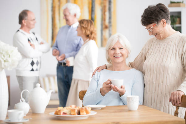 istock Elderly woman and smiling friend 909587126