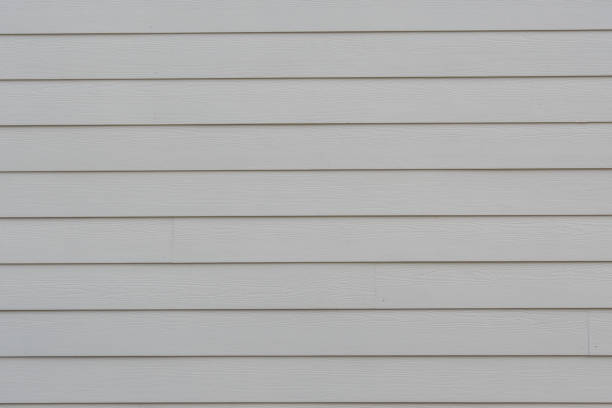 istock Cream Siding of House 909591060