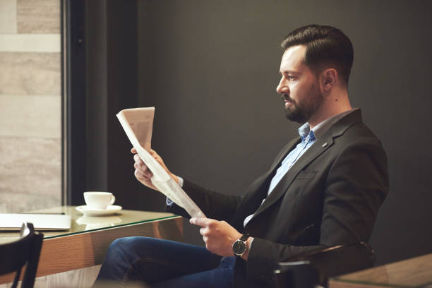 istock Businessman sitting in cafe. 909597996