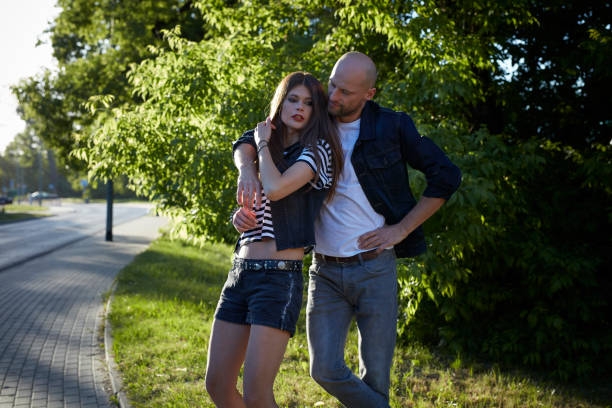 istock Couple on a date. Summer walk 909606106