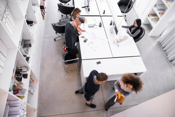 istock Office architect team working on tasks - New and young business 909608988