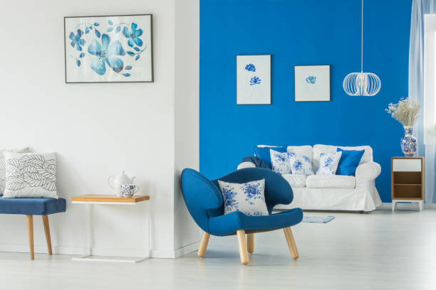 istock Armchair in bright living room 909609268
