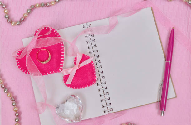 istock Valentines day hearts and notepad for your text. Top view on wooden table 909610422