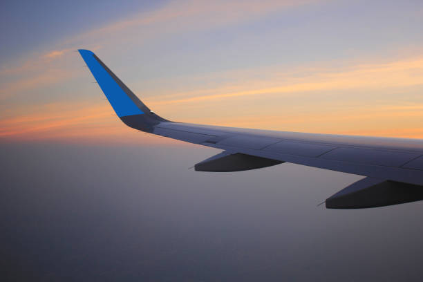 istock Beautiful of view clouds and sky on evening sunset light from airplane window 909612778