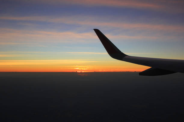 istock Beautiful of view clouds and sky on evening sunset light from airplane window 909612804