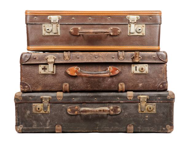 istock Old suitcases isolated on white background 909613478