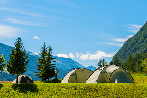 Camp by the river in the setting sun