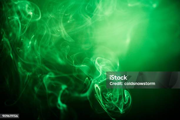 Green Swirling Smoke Abstract Close Up On Black Background Stock Photo - Download Image Now