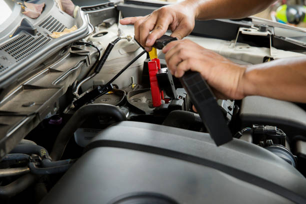 istock Engine engineer is replacing car battery because car battery is depleted. 909621346
