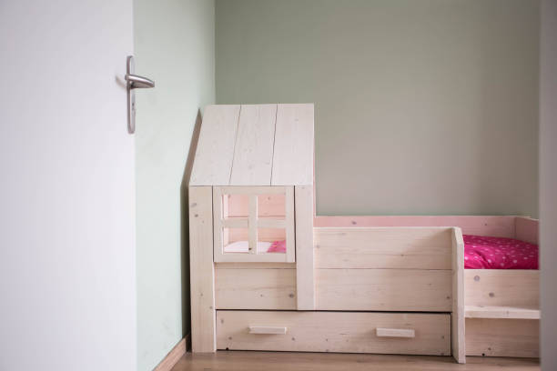 istock Child room with wood bed modern design 909621878