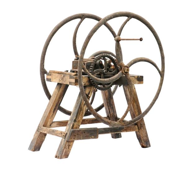 istock Old wooden chaff cutter isolated on white background 909628732