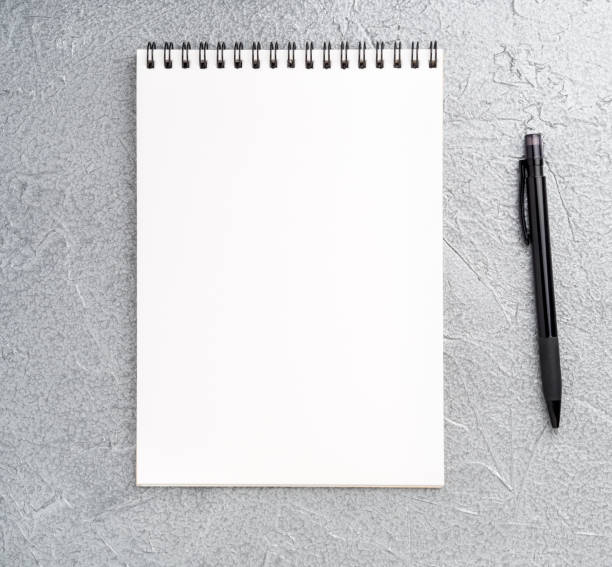 istock blank sheet of notebook with a spiral on a neutral gray textured silver metallic background 909630166