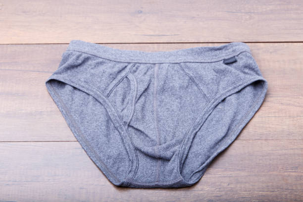 istock Male underpants on wooden background 909635546
