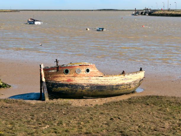 istock Decayed boat at Orford, Suffolk 909638660