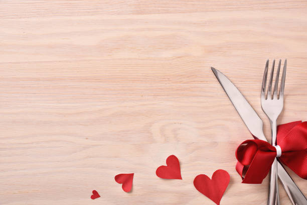 istock Table decorated with red ornaments for valentines on wood table 909640052