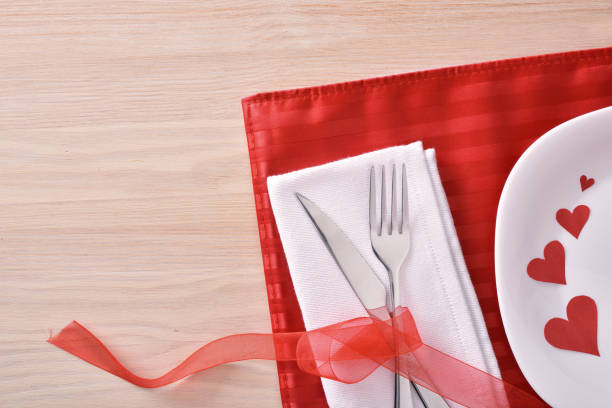 istock Table decorated with red ornaments for valentines day 909640078