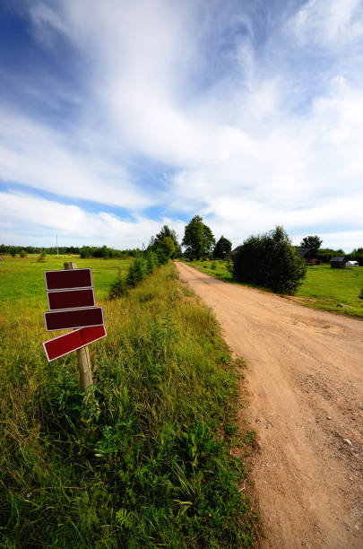 istock classic rural landscape. Green field against blue sky 909644442
