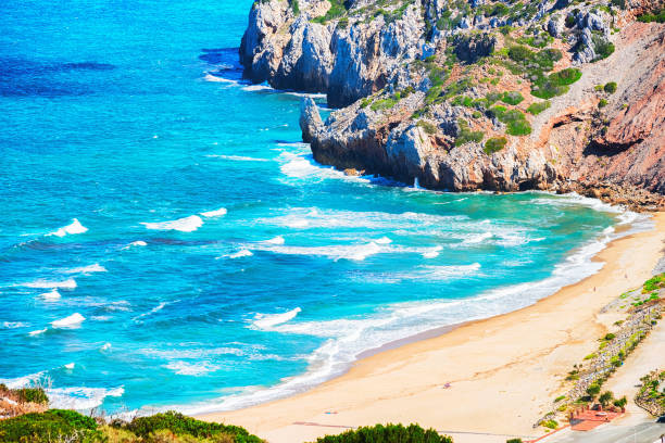 istock Cala Domestica beach in Buggerru resort in Mediterranean Sea Sardinia 909644828