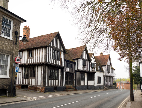 A row of traditional old half-timbered buildings in the picturesque town of Sudbury in Suffolk, Eastern England, on a winter’s day.