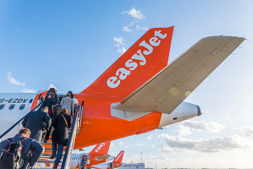 London Gatwick, UK - Nov 23rd, 2017: Passengers board an Easyjet airplane at London's Gatwick airport